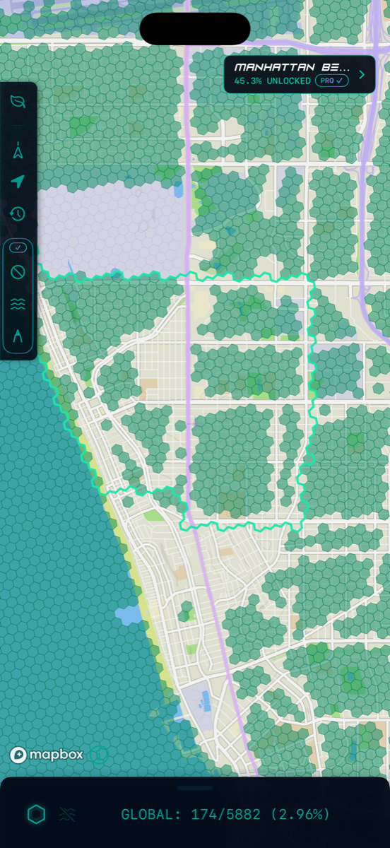 street-level view: small hexagonal tiles cleared along the streets that have been walked, fog over the blocks that haven't